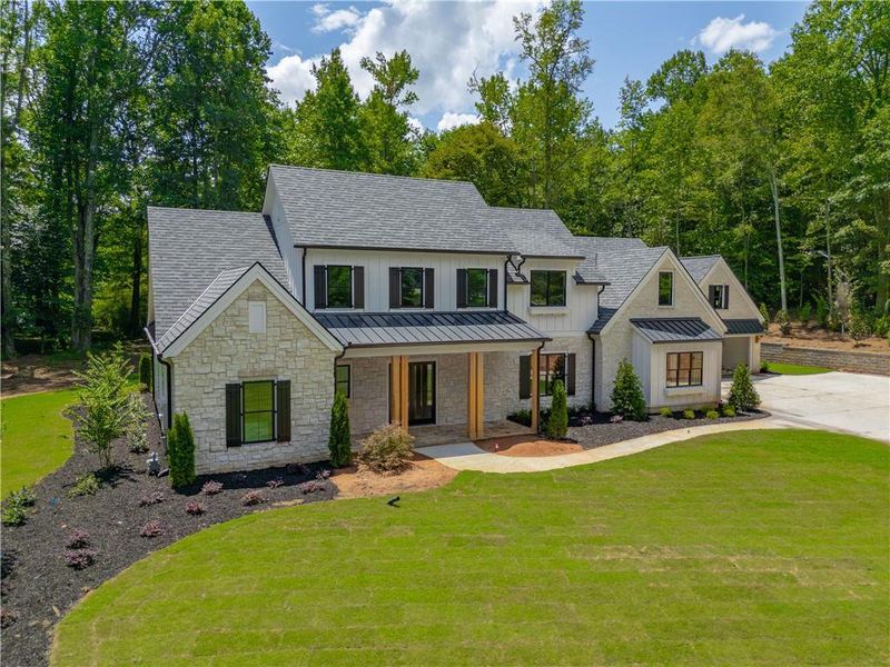 Front exterior of a new home in , Canton, GA, highlighting curb appeal (Image 13).
