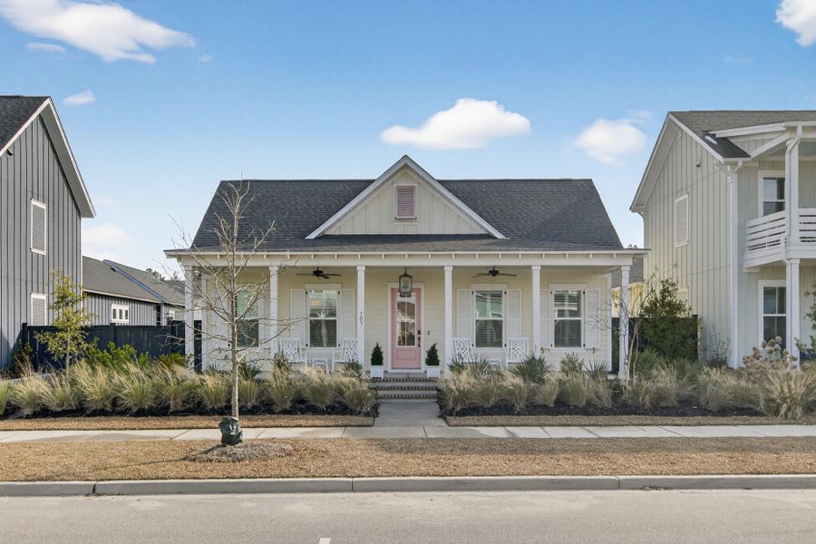 Front exterior of a new home in The Domus Collection at Midtown Nexton, Summerville, SC, highlighting curb appeal (Image 28). Front exterior of a new home in The Domus Collection at Midtown Nexton, Summerville, SC, highlighting curb appeal (Image 28).