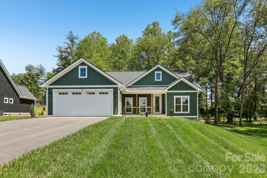 Front exterior of a new home in , Hendersonville, NC, highlighting curb appeal (Image 19).