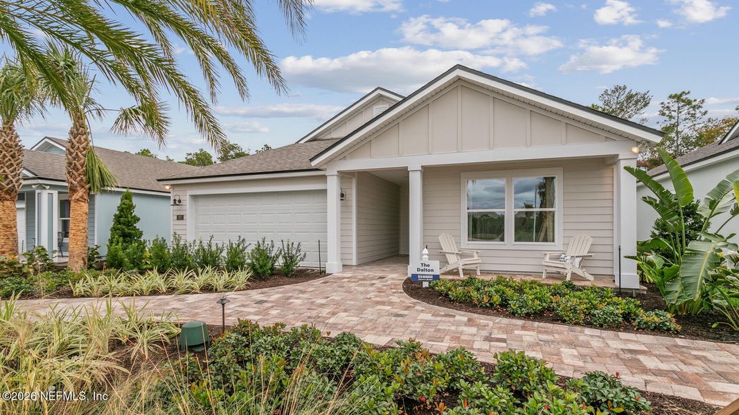 Front exterior of a new home in Sawmill Branch, Palm Coast, FL, highlighting curb appeal (Image 25).