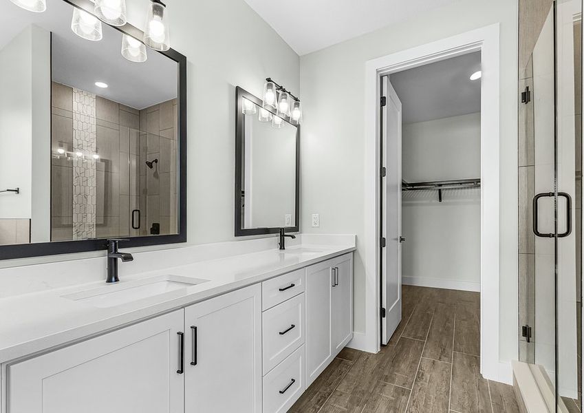 Master bath has a dual-sink vanity.