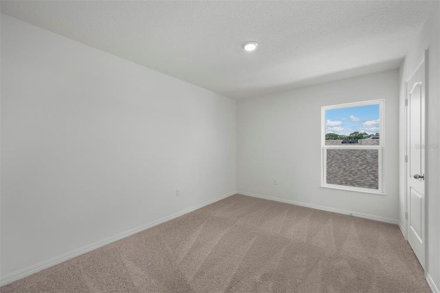 Spacious, unfurnished interior of a new home in Peach Crossings, Winter Haven (Image 20).