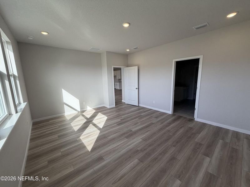 Spacious, unfurnished interior of a new home in The Cypress Series at Reserve East, Flagler Beach (Image 15).