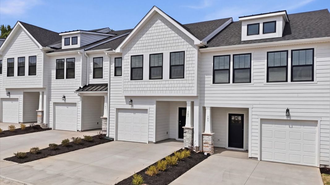 Front exterior of a new home in Gresham Station, Simpsonville, SC, highlighting curb appeal (Image 20). Front exterior of a new home in Gresham Station, Simpsonville, SC, highlighting curb appeal (Image 20).
