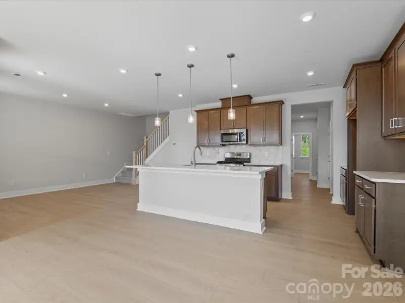 Chef-inspired kitchen with rich brown cabinets