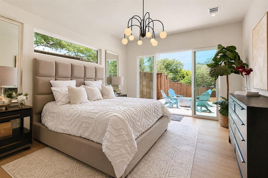 Enjoy your private patio off the primary bedroom with abundant natural light.