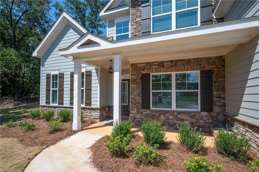 Front exterior of a new home in The Landing at Miller’s Ferry, Adairsville, GA, highlighting curb appeal (Image 2). Front exterior of a new home in The Landing at Miller’s Ferry, Adairsville, GA, highlighting curb appeal (Image 2).