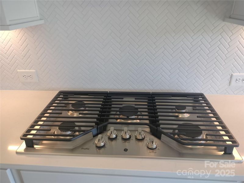 36" 5-burner Gas Cooktop with Vented Hood - Representative Photo
