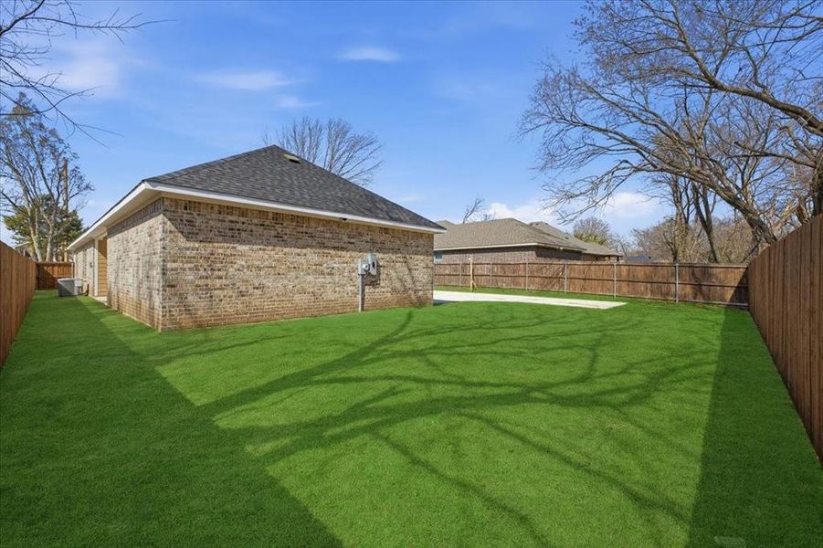 View of fenced backyard