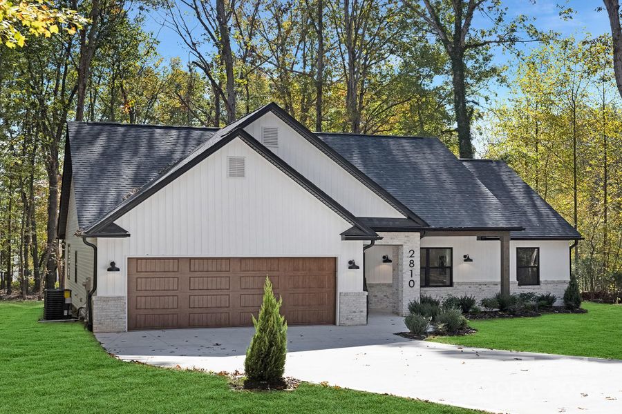 Front exterior of a new home in , Gastonia, NC, highlighting curb appeal (Image 22).