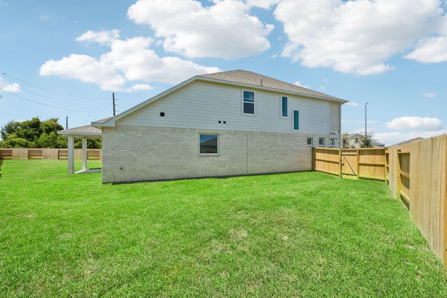 Exterior details and patio area of a home in Heights of Barbers Hill, Baytown (Image 28).