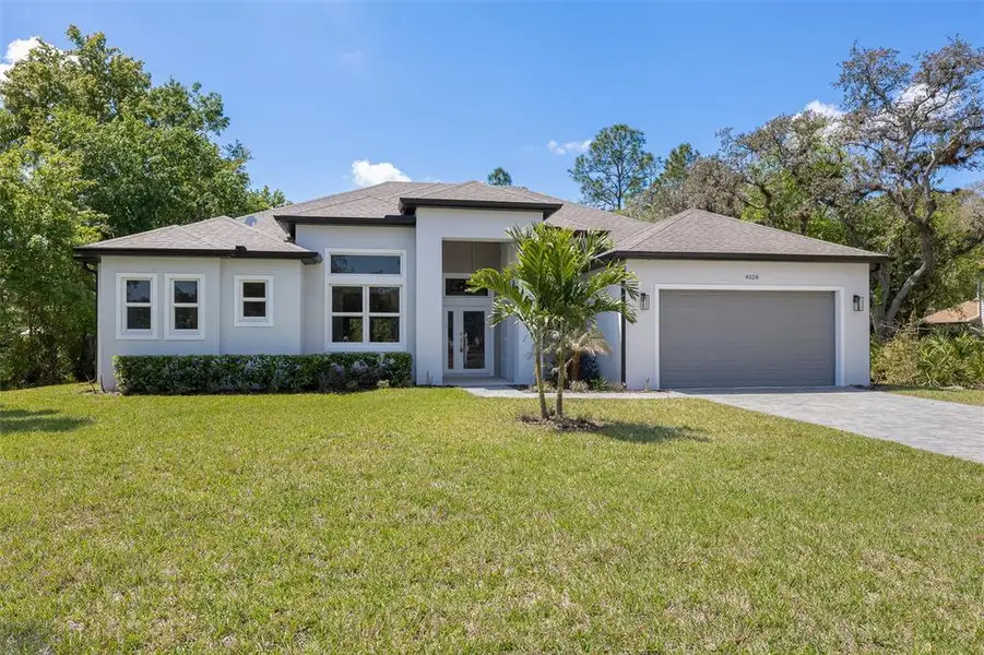 Front exterior of a new home in , Kissimmee, FL, highlighting curb appeal (Image 1). Front exterior of a new home in , Kissimmee, FL, highlighting curb appeal (Image 1).