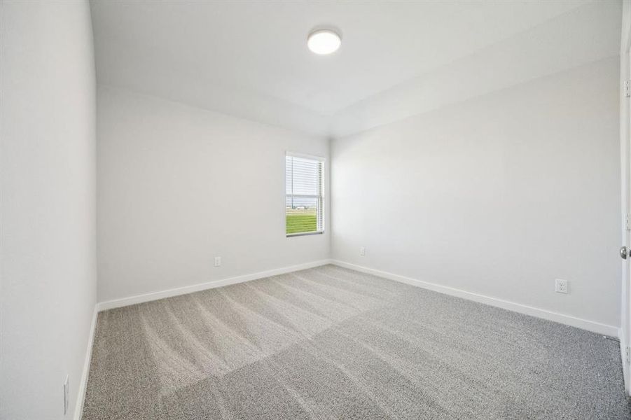 Bedroom in the Masters home plan by Trophy Signature Homes – REPRESENTATIVE PHOTO