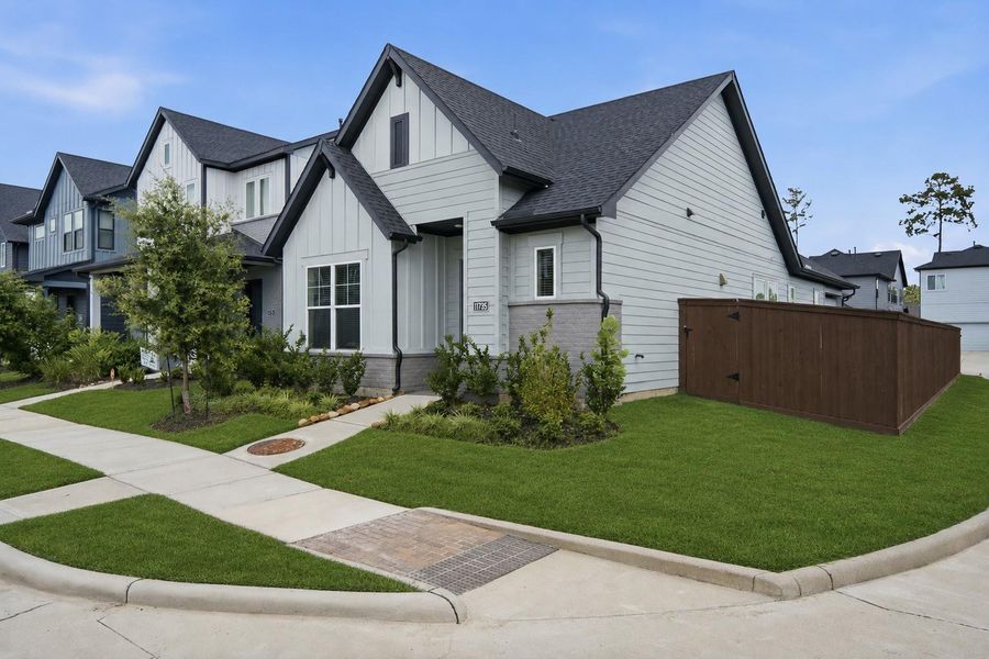 Front exterior of a new home in The Groves 35', Humble, TX, highlighting curb appeal (Image 20).