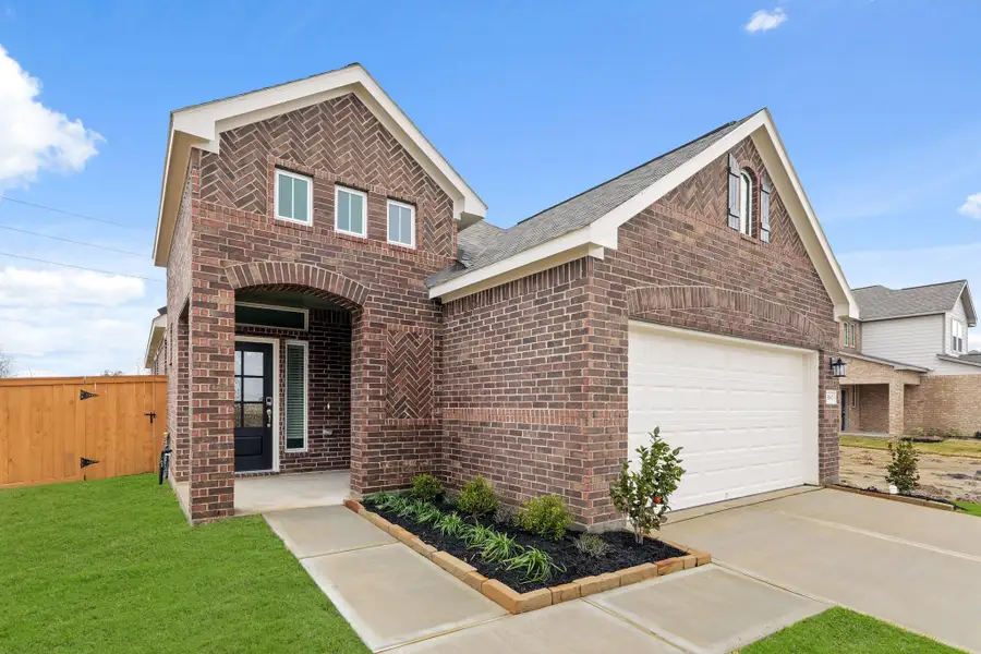 Front exterior of a new home in River Ranch Trails, Angleton, TX, highlighting curb appeal (Image 1). Front exterior of a new home in River Ranch Trails, Angleton, TX, highlighting curb appeal (Image 1).