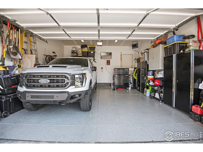 HEATED, insulated garage/shop with lighting, gas furnace, epoxy flooring