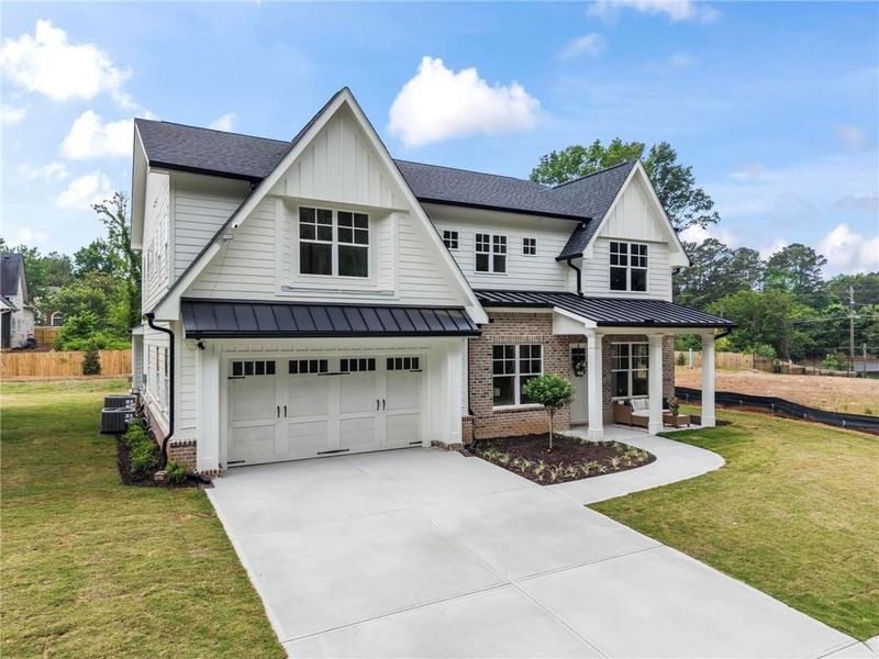 Front exterior of a new home in , Marietta, GA, highlighting curb appeal (Image 1). Front exterior of a new home in , Marietta, GA, highlighting curb appeal (Image 1).