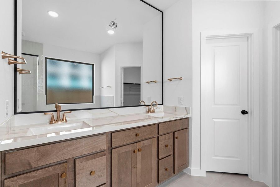 Main Bathroom With Ample Storage & Designer Charm