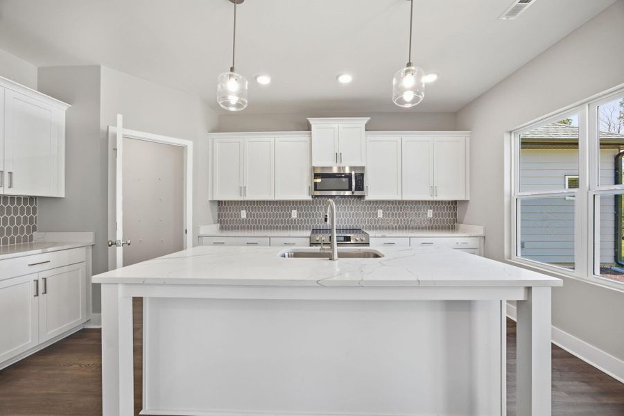 Spacious Kitchen and Open Living Design in The Anderson