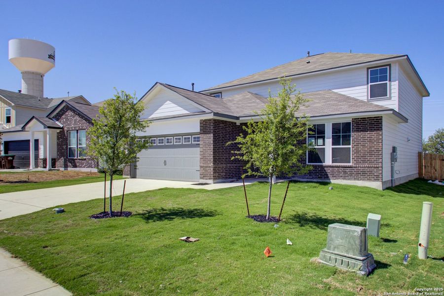 Front exterior of a new home in Hickory Ridge, San Antonio, TX, highlighting curb appeal (Image 40).
