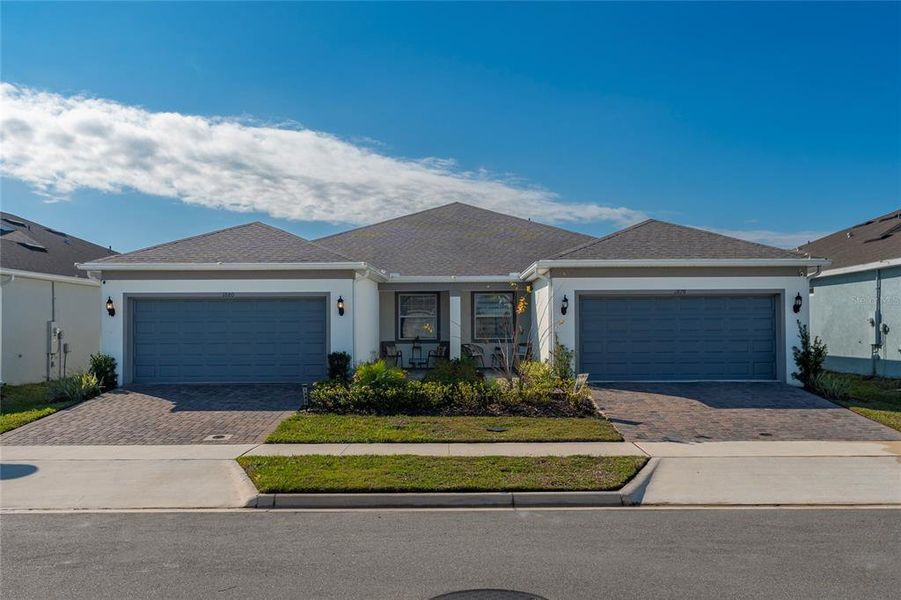 Front exterior of a new home in , Kissimmee, FL, highlighting curb appeal (Image 25).