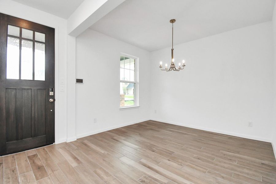 Spacious, unfurnished interior of a new home in Sunterra, Katy (Image 14).