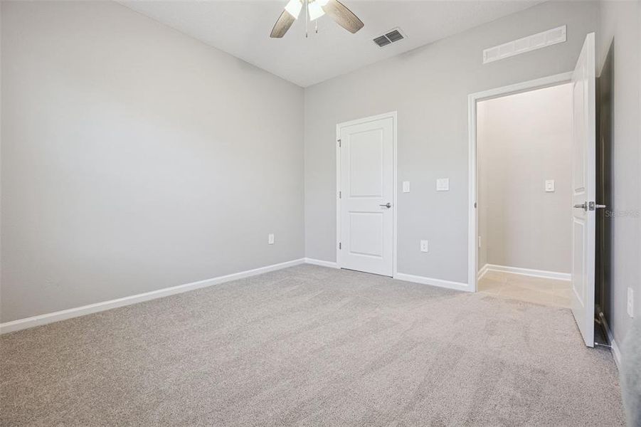 Spacious, unfurnished interior of a new home in Wellness Ridge, Clermont (Image 29).