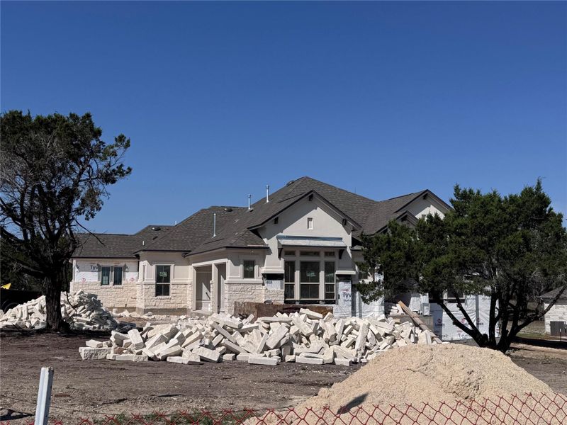 Front exterior of a new home in ClearWater Ranch, Liberty Hill, TX, highlighting curb appeal (Image 1). Front exterior of a new home in ClearWater Ranch, Liberty Hill, TX, highlighting curb appeal (Image 1).
