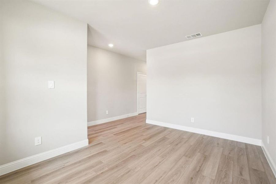 Empty room featuring recessed lighting and light wood-style floors Empty room featuring recessed lighting and light wood-style floors