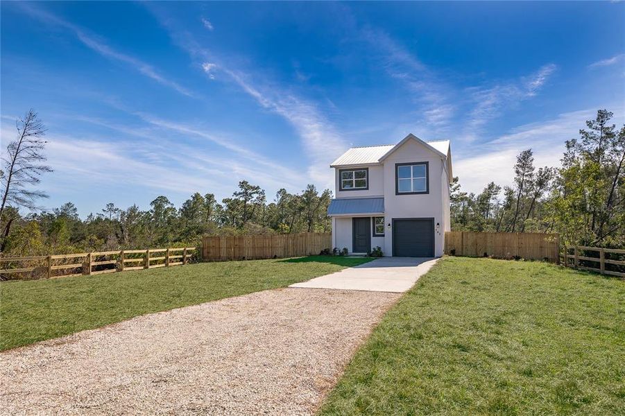 Front exterior of a new home in , Osteen, FL, highlighting curb appeal (Image 14).