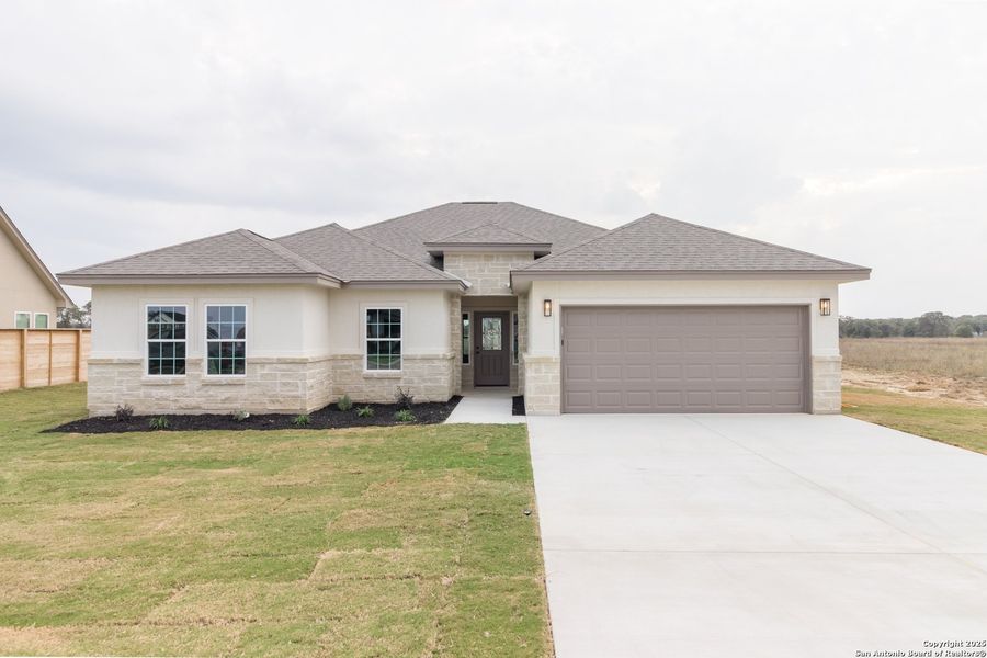 Front exterior of a new home in , La Vernia, TX, highlighting curb appeal (Image 17). Front exterior of a new home in , La Vernia, TX, highlighting curb appeal (Image 17).