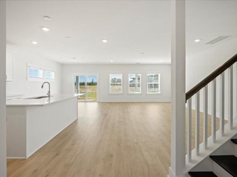 Spacious, unfurnished interior of a new home in The Coves at Lakes of Cane Bay, Summerville (Image 18).