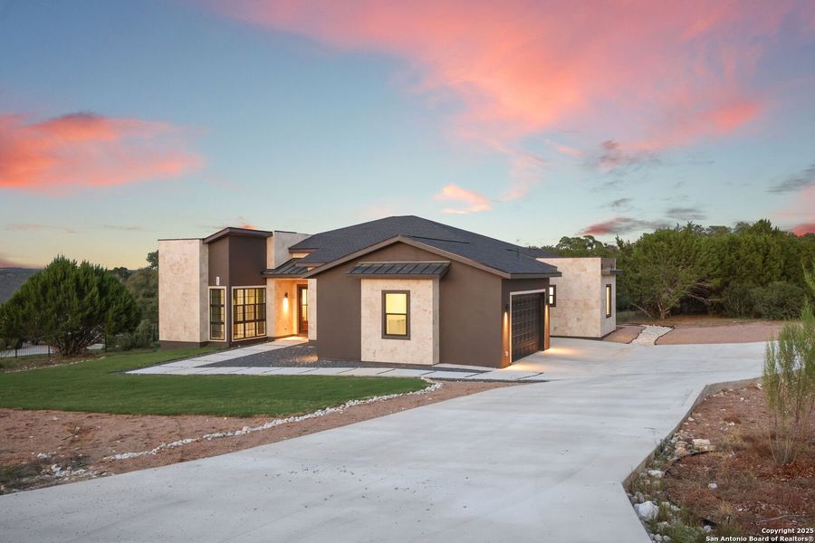 Front exterior of a new home in , Spring Branch, TX, highlighting curb appeal (Image 1).
