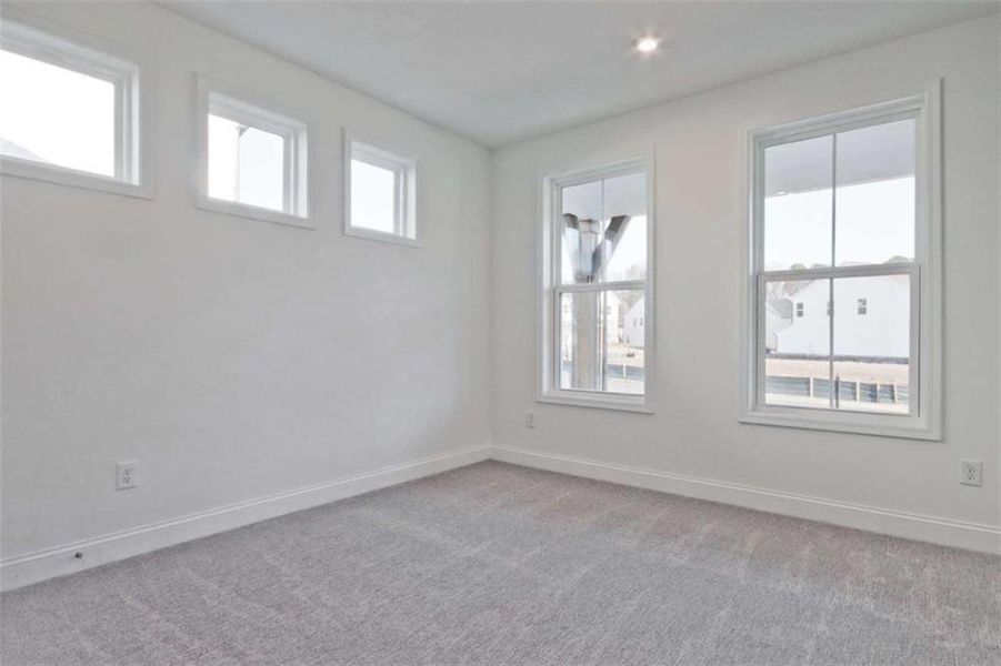 Spacious, unfurnished interior of a new home in The Paddocks at Doc Hughes, Buford (Image 20).