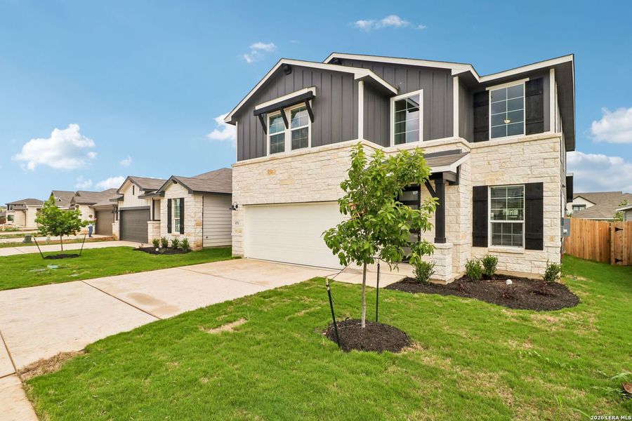 Front exterior of a new home in Estancia Ranch - Premier Series, San Antonio, TX, highlighting curb appeal (Image 2). Front exterior of a new home in Estancia Ranch - Premier Series, San Antonio, TX, highlighting curb appeal (Image 2).