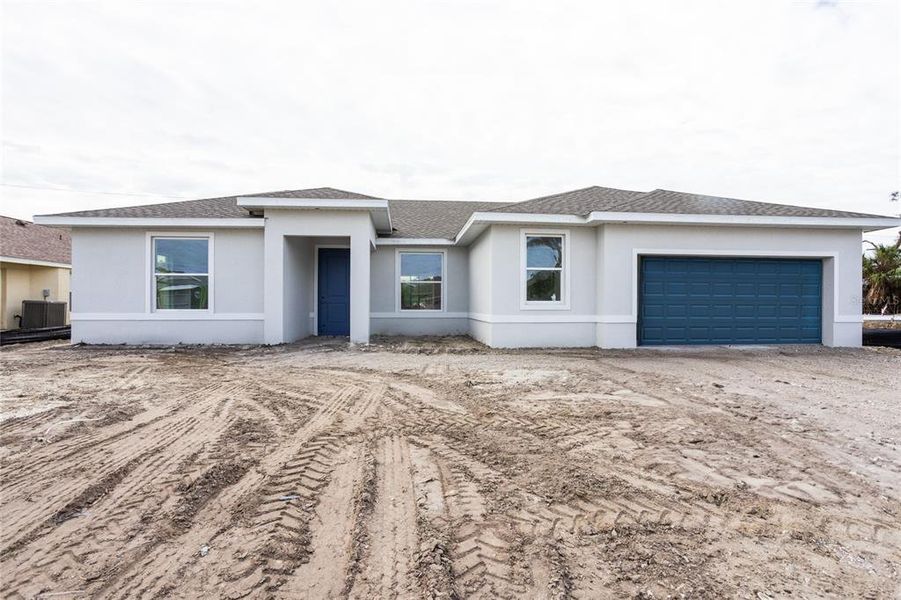 Front exterior of a new home in , Englewood, FL, highlighting curb appeal (Image 2). Front exterior of a new home in , Englewood, FL, highlighting curb appeal (Image 2).