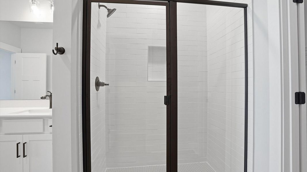 Notable primary bath featuring a spacious walk-in shower and tasteful design touches throughout in Anderson, SC Notable primary bath featuring a spacious walk-in shower and tasteful design touches throughout in Anderson, SC