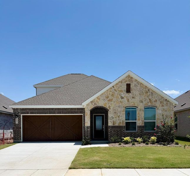 Front exterior of a new home in Legacy Hills, Celina, TX, highlighting curb appeal (Image 1). Front exterior of a new home in Legacy Hills, Celina, TX, highlighting curb appeal (Image 1).