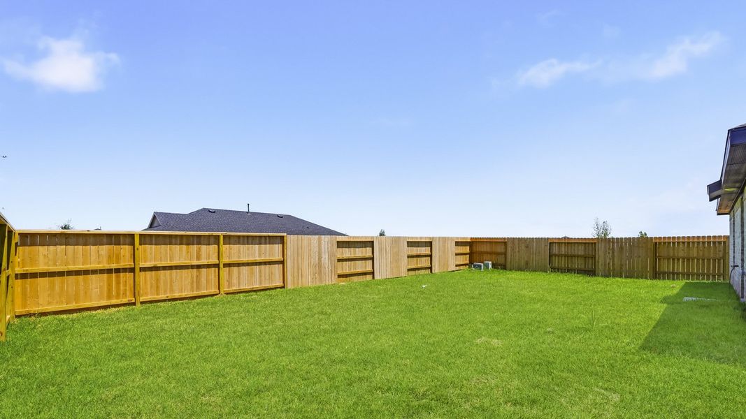 Exterior details and patio area of a home in Sunterra, Katy (Image 3).
