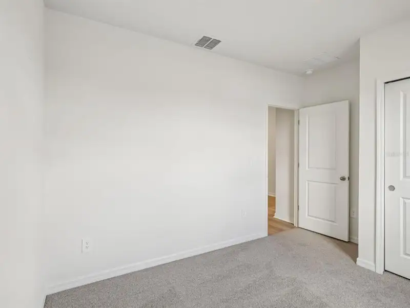 Spacious, unfurnished interior of a new home in The Reserve at Van Oaks, Auburndale (Image 10).