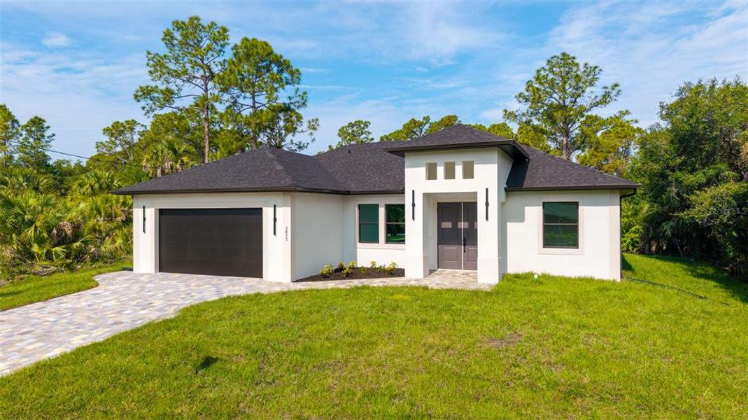 Front exterior of a new home in , North Port, FL, highlighting curb appeal (Image 30). Front exterior of a new home in , North Port, FL, highlighting curb appeal (Image 30).