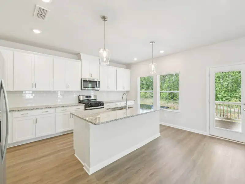Furnished interior view inside a new home in Vines at Mill Creek - Estate Series, Braselton (Image 4).