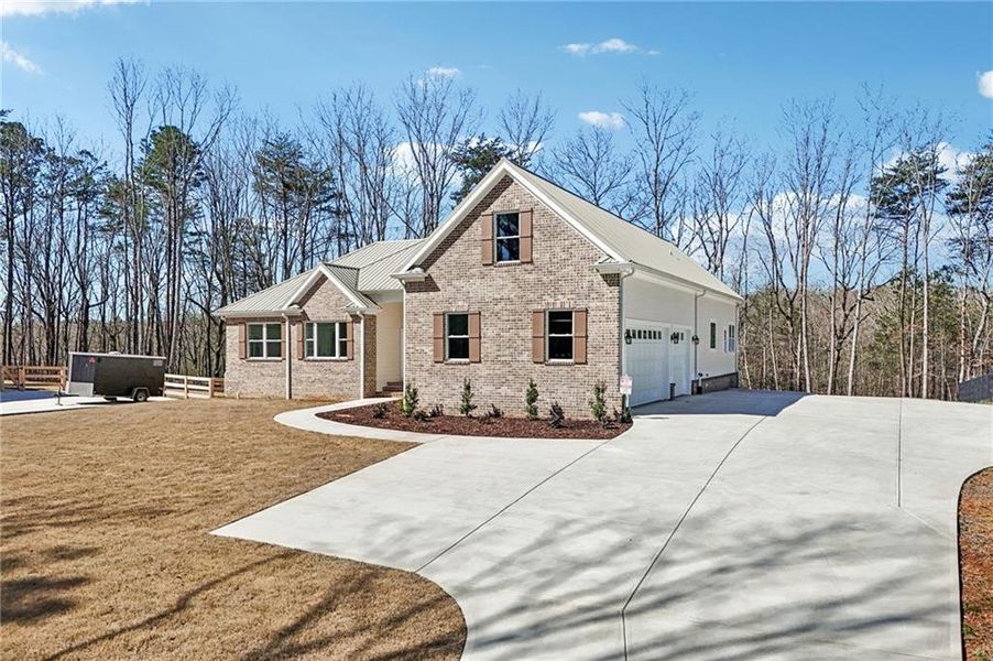Front exterior of a new home in , Canton, GA, highlighting curb appeal (Image 35).
