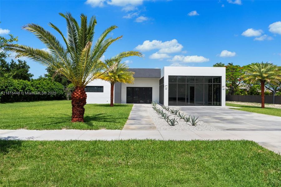 Front exterior of a new home in , Homestead, FL, highlighting curb appeal (Image 20).