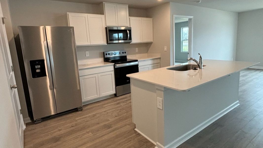 Furnished interior view inside a new home in The Parks, White House (Image 16).