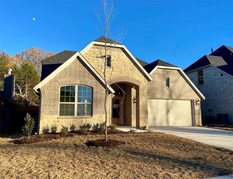 Beautiful brick & stone elevation backing to large trees on a quiet cul-de-sac.