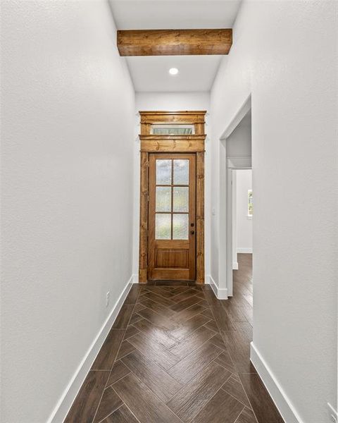 Entryway with beam ceiling and baseboards Entryway with beam ceiling and baseboards