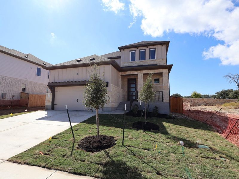 Front exterior of a new home in Marble Creek Crossing, Austin, TX, highlighting curb appeal (Image 1). Front exterior of a new home in Marble Creek Crossing, Austin, TX, highlighting curb appeal (Image 1).