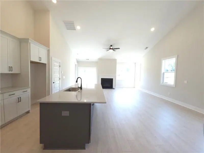This open concept living space features a kitchen