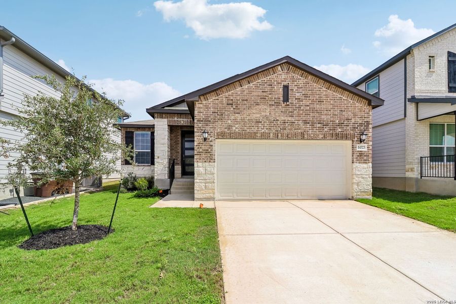 Front exterior of a new home in Thomas Pond, San Antonio, TX, highlighting curb appeal (Image 2). Front exterior of a new home in Thomas Pond, San Antonio, TX, highlighting curb appeal (Image 2).